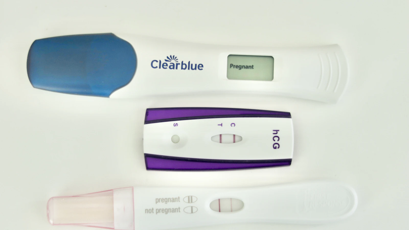 Home pregnancy tests on a white surface