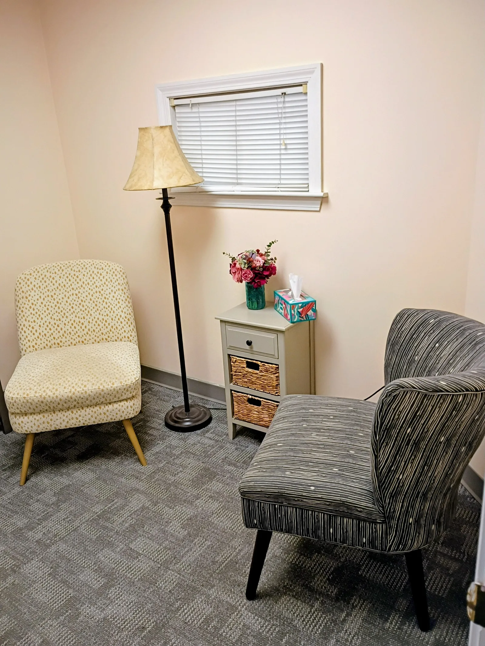 A consultation room at our Revere clinic with two facing chairs, soft lighting, and a calm, welcoming atmosphere.